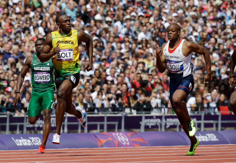 Illustration for article titled Photos Of Usain Bolt Looking Bored As He Blows Past The Best Runners In The World